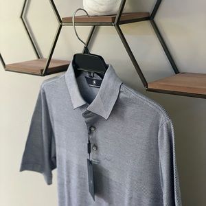 It is a Hart Schaffner Marx polo shirt. It is a size small and is brand new.